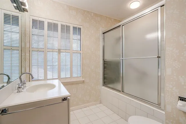 a bathroom with a sink and a shower