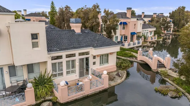 a aerial view of a house with a yard