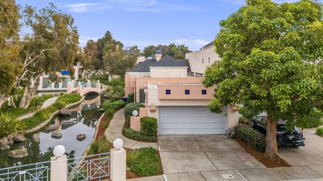 an aerial view of a house with a yard basket ball court and outdoor seating