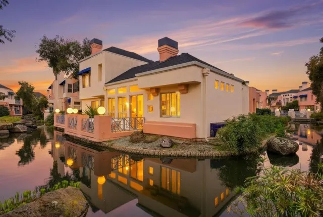 a front view of a house with a lake view