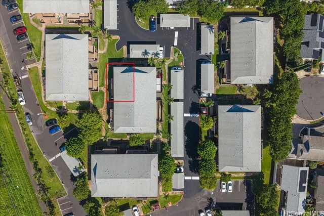 an aerial view of residential houses with outdoor space