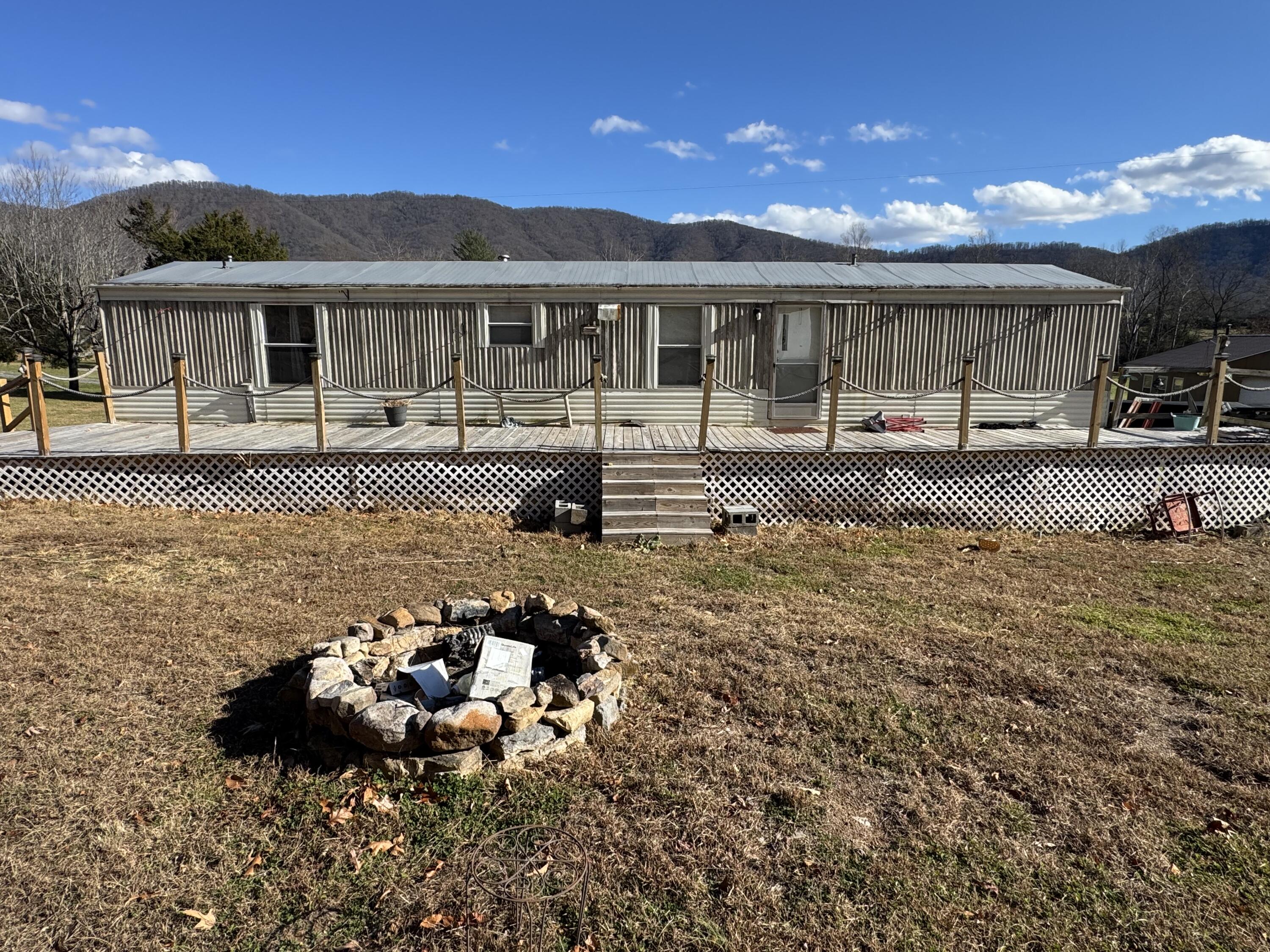1333 Falling Leaf Lane Montvale, VA 24122 - Photo 1 of 7 a view of a house with backyard and sitting area