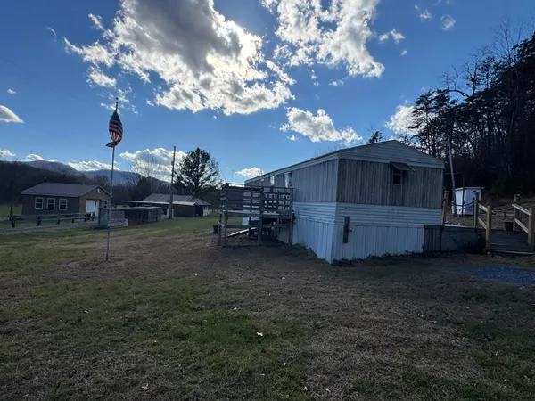 a view of a house with a back yard