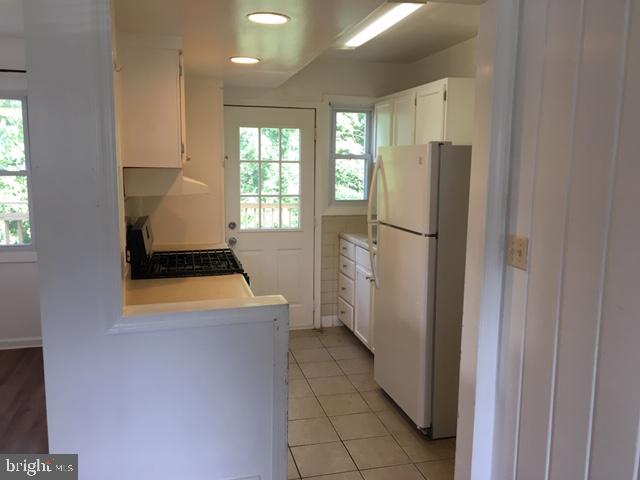 12031 Bluhill Road Silver Spring, MD 20902 - Photo 4 of 20 Kitchen with ceramic title floor/adjoining deck