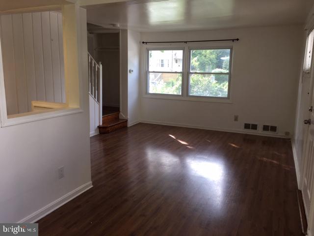 12031 Bluhill Road Silver Spring, MD 20902 - Photo 7 of 20 Living Room/Laminate Flooring throughout