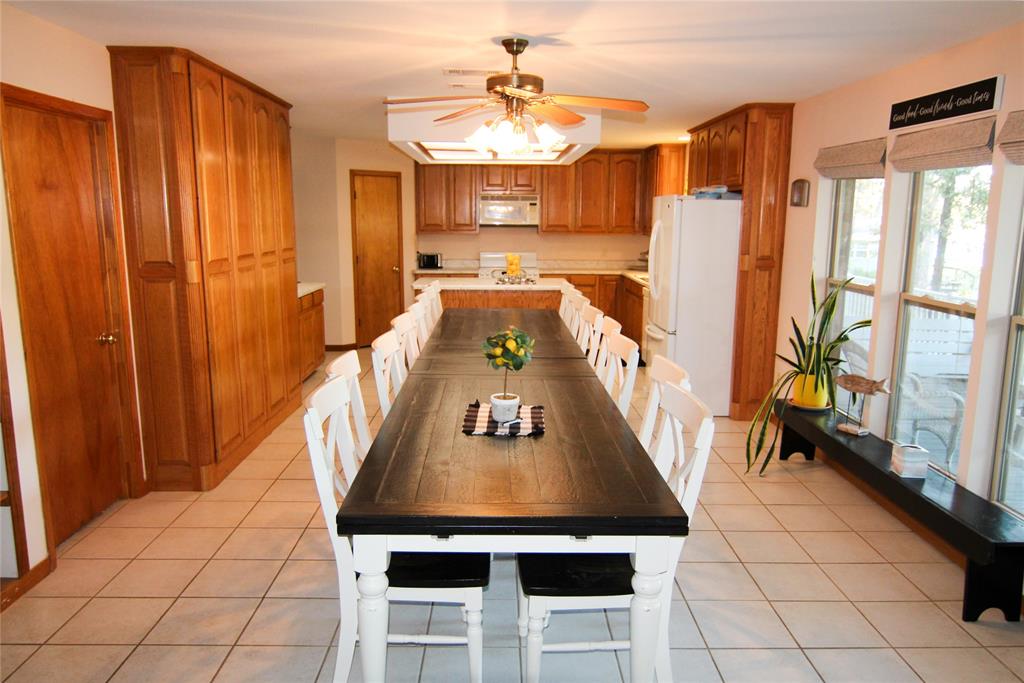 6928 Scott Street Eustace, TX 75124 - Photo 13 of 37 a living room with stainless steel appliances furniture a rug and a view of kitchen