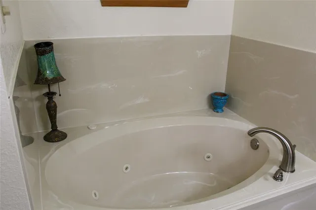 a close view of a bathtub in a bathroom