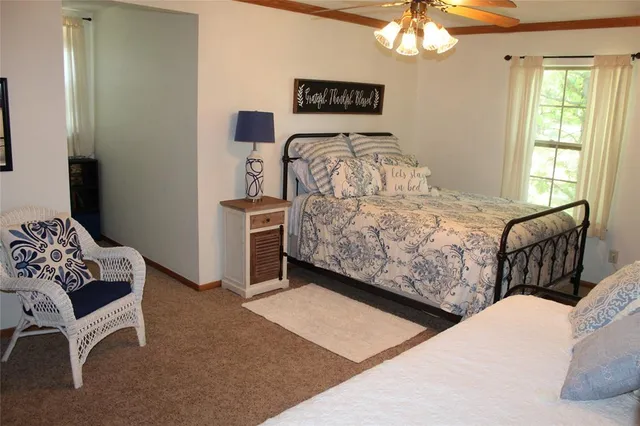 a bedroom with furniture and a window