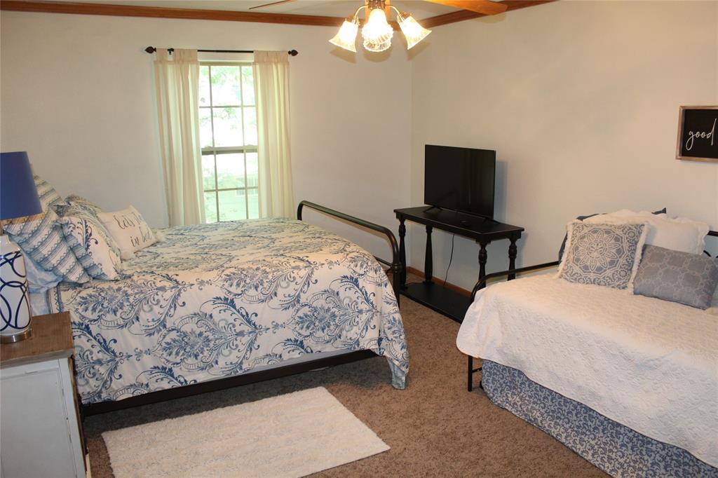 6928 Scott Street Eustace, TX 75124 - Photo 24 of 37 a bedroom with a bed and a window