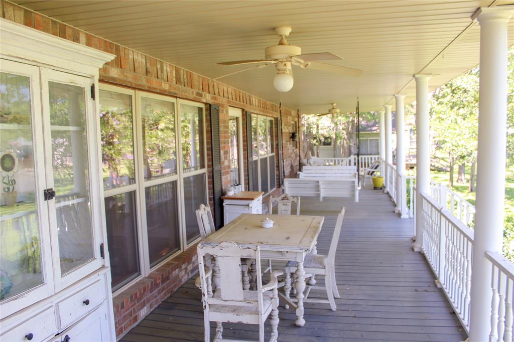 6928 Scott Street Eustace, TX 75124 - Photo 27 of 37 a view of a dining room with furniture a chandelier and wooden floor