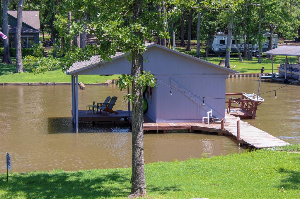 6928 Scott Street Eustace, TX 75124 - Photo 31 of 37 a backyard of a house with table and chairs