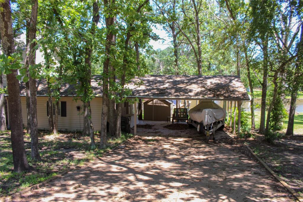 6928 Scott Street Eustace, TX 75124 - Photo 36 of 37 a view of a patio with table and chairs under an umbrella