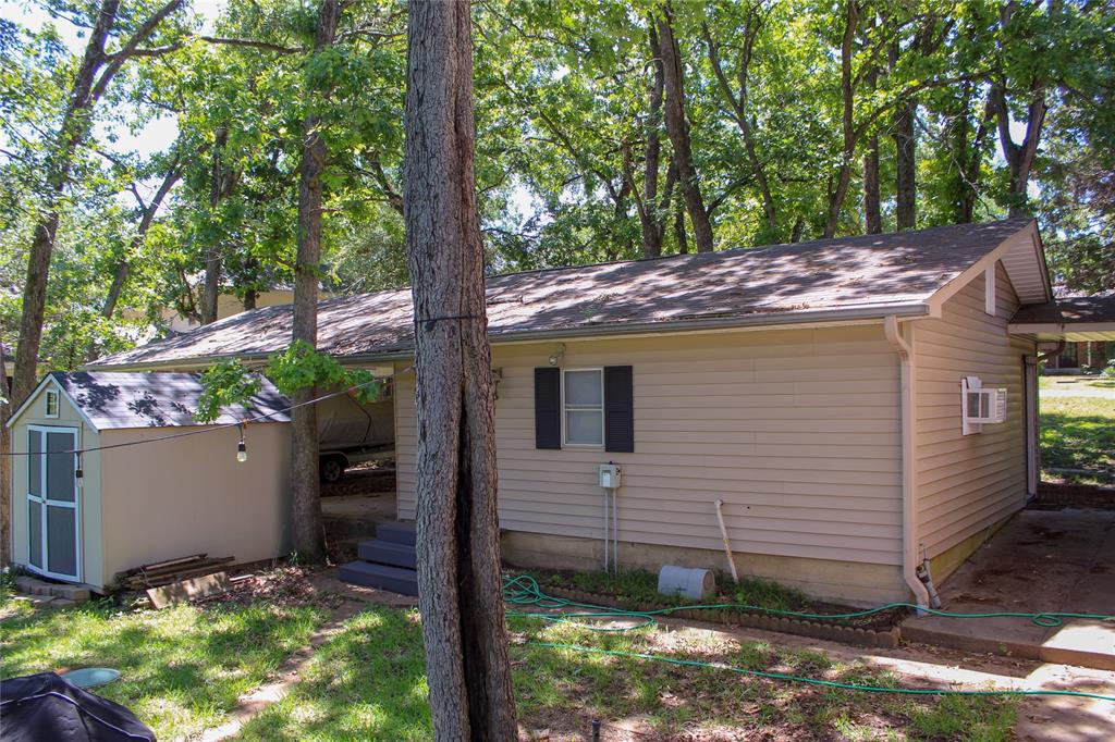 6928 Scott Street Eustace, TX 75124 - Photo 37 of 37 a view of an house with backyard and trees