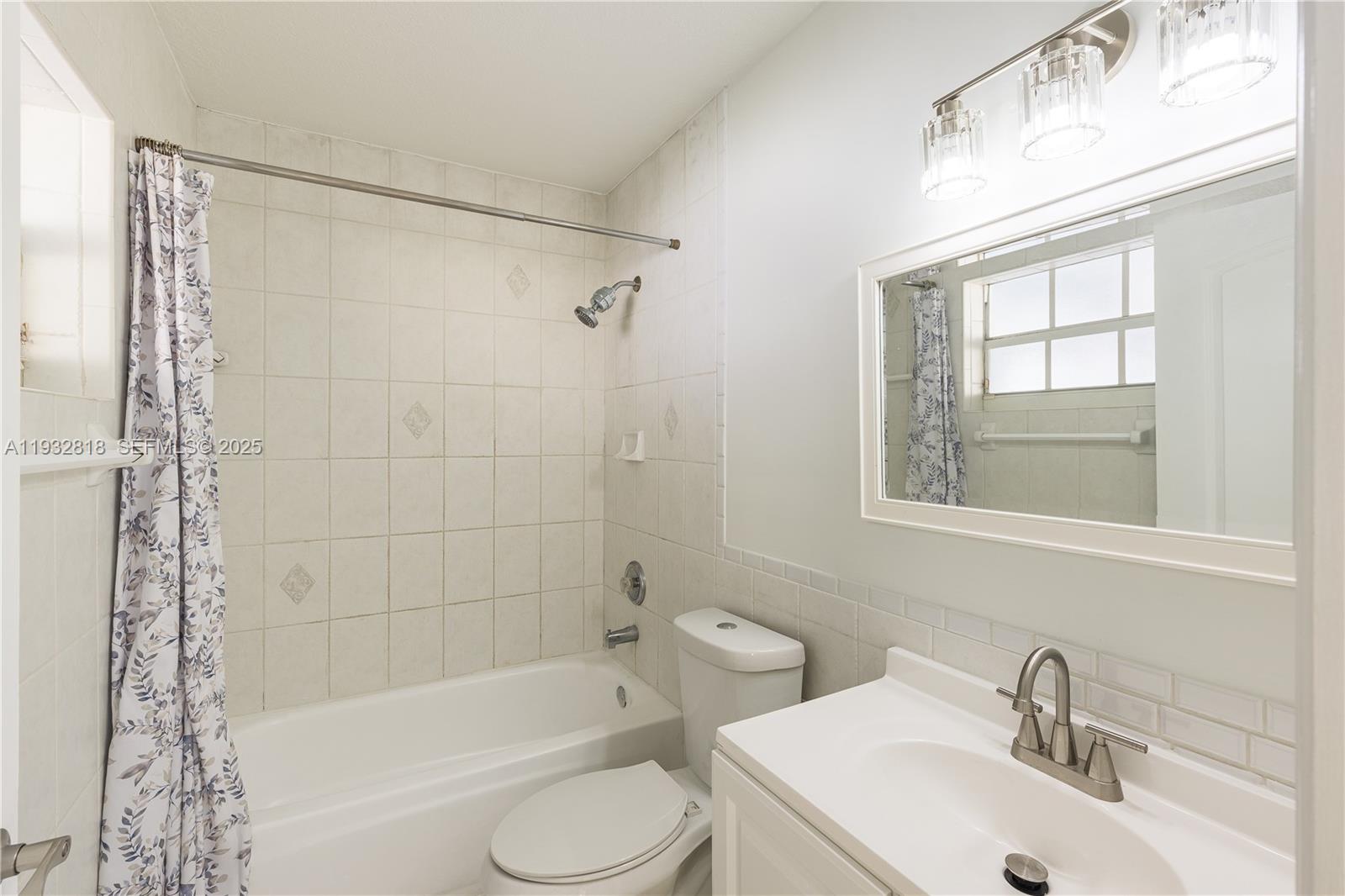 13797 Southwest 154th Street Miami, FL 33177 - Photo 11 of 14 a bathroom with a sink toilet and shower