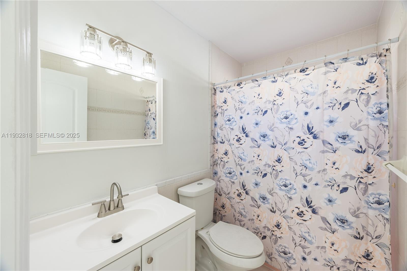 13797 Southwest 154th Street Miami, FL 33177 - Photo 14 of 14 a bathroom with a sink toilet and shower