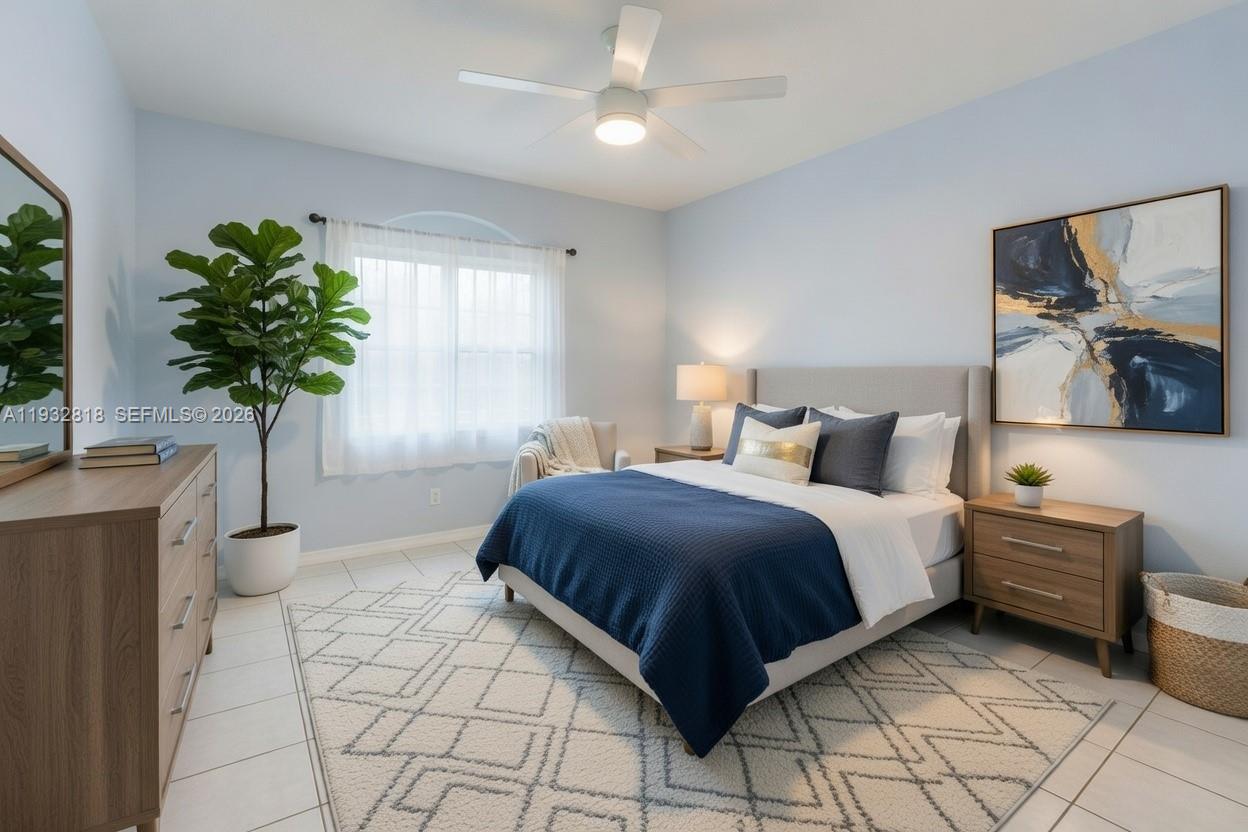13797 Southwest 154th Street Miami, FL 33177 - Photo 16 of 22 a bedroom with a bed potted plant with the view of mirror
