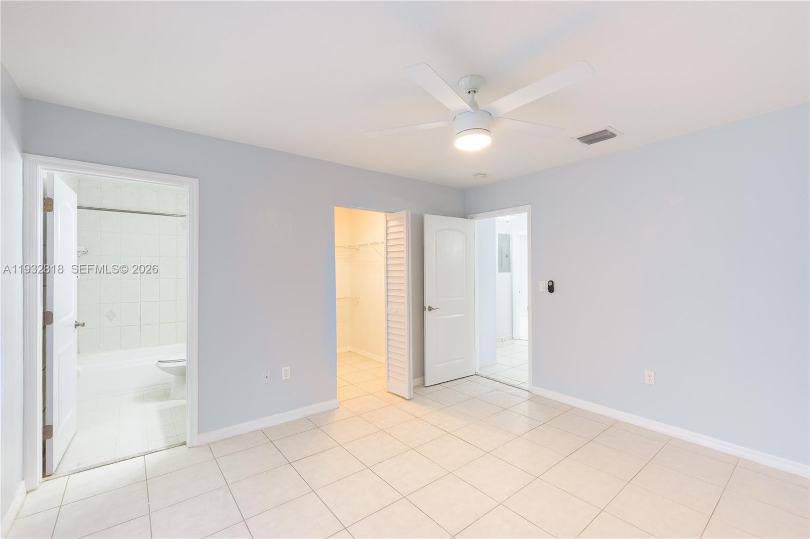 13797 Southwest 154th Street Miami, FL 33177 - Photo 21 of 22 a view of an empty room and window