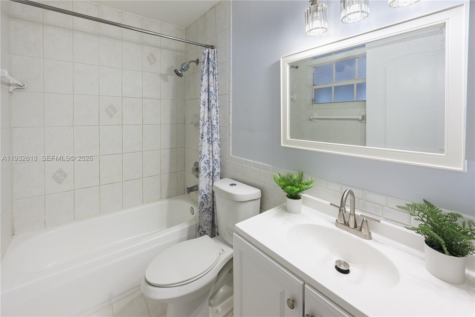 13797 Southwest 154th Street Miami, FL 33177 - Photo 22 of 22 a bathroom with a sink toilet and shower