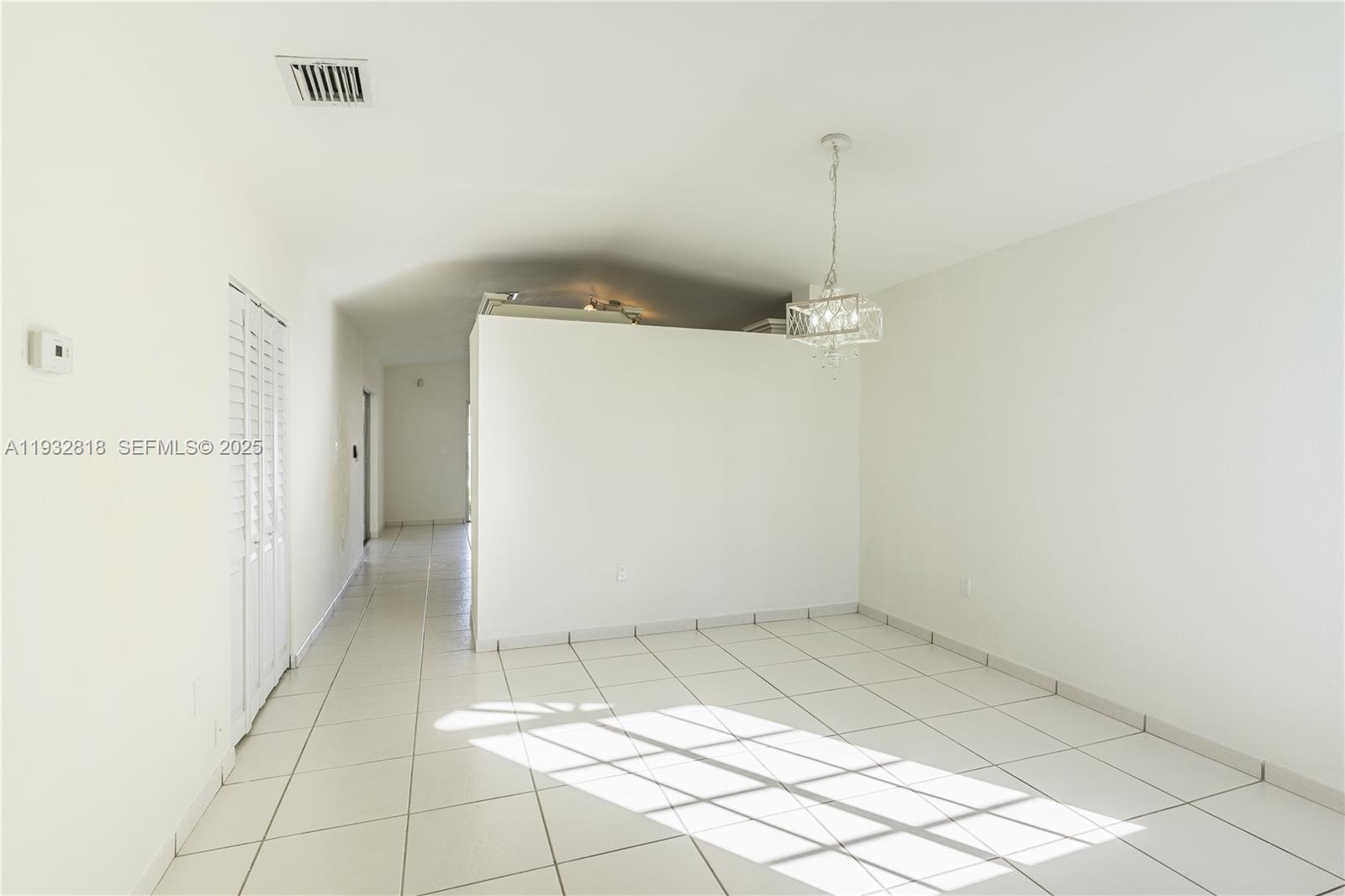 13797 Southwest 154th Street Miami, FL 33177 - Photo 4 of 14 a view of a room with an empty space