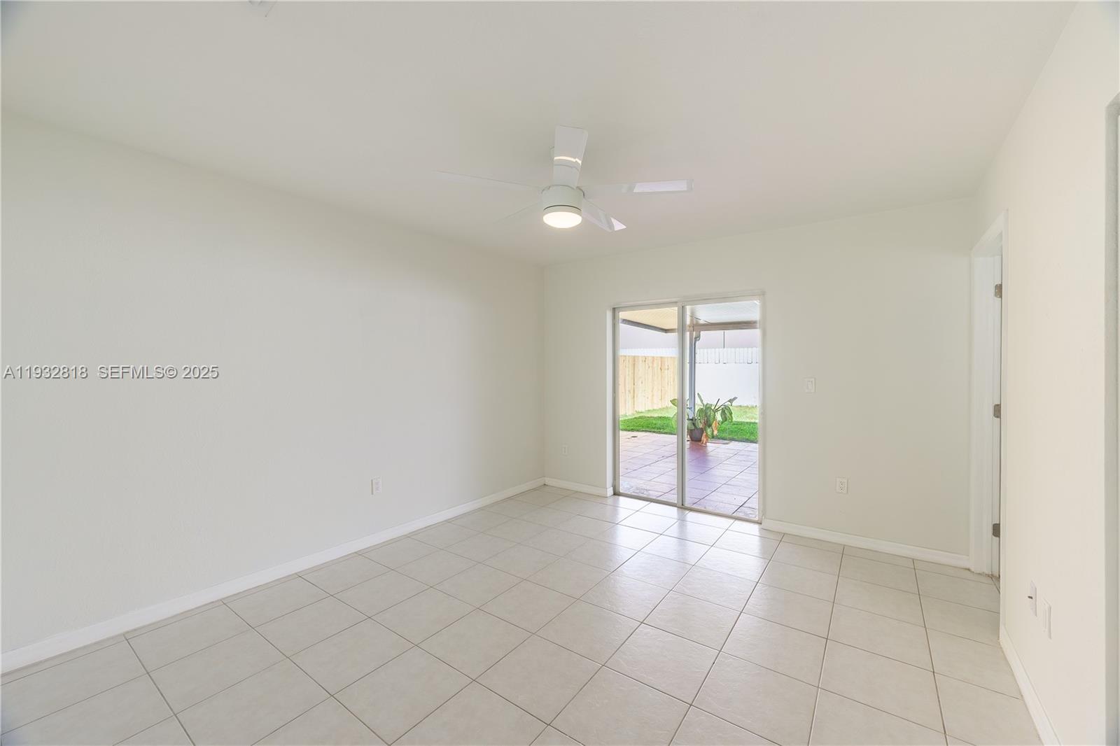 13797 Southwest 154th Street Miami, FL 33177 - Photo 9 of 14 a view of an empty room and window