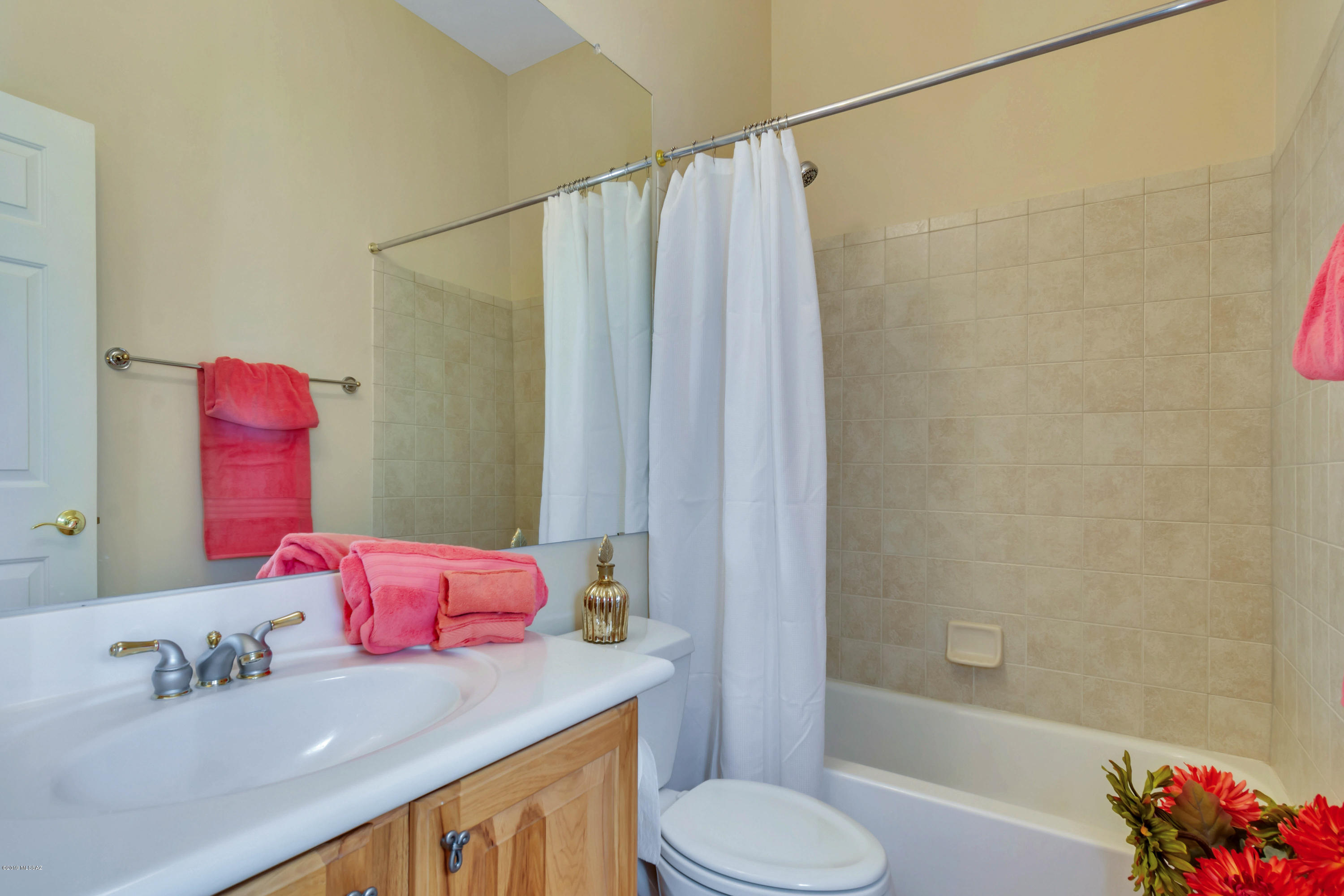 12682 North Spirit Mountain Road Oro Valley, AZ 85755 - Photo 34 of 40 a bathroom with a sink toilet and shower