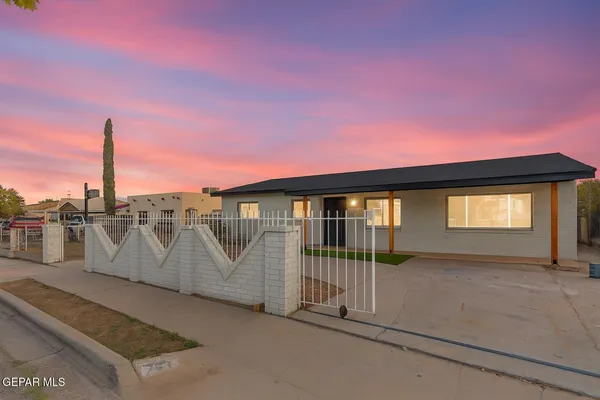 a view of a house with a street