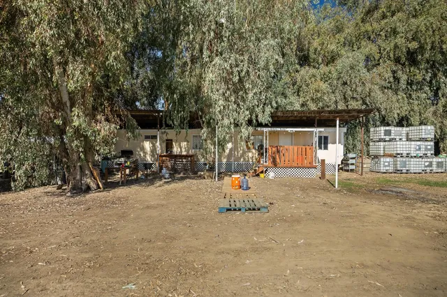 a view of a house with a yard and garage