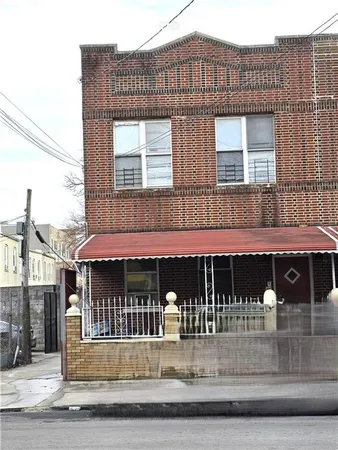 a front view of a building with glass windows and door