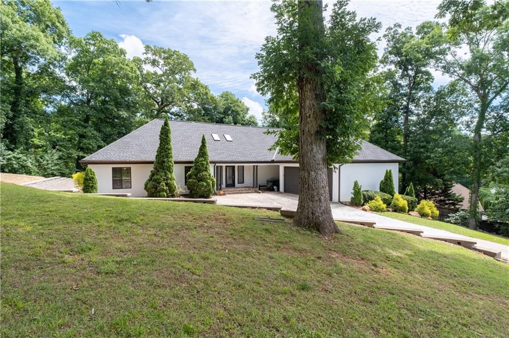 4610 West Morton Road Alpharetta, GA 30022 - Photo 3 of 53 a house view with a garden space