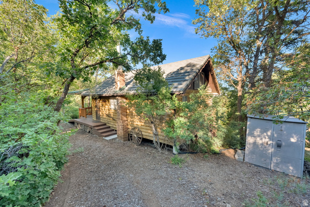 1234 Maple Lane, Unit 123 Midway, UT 84049 - Photo 14 of 19 Wood-sided cabin with a pitched roof and front porch