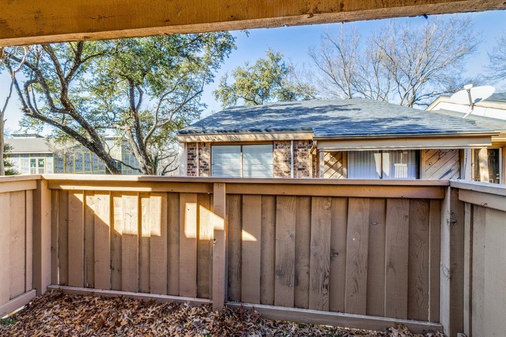 8110 Skillman Street, Unit 2019 Dallas, TX 75231 - Photo 13 of 13 a view of a wooden fence
