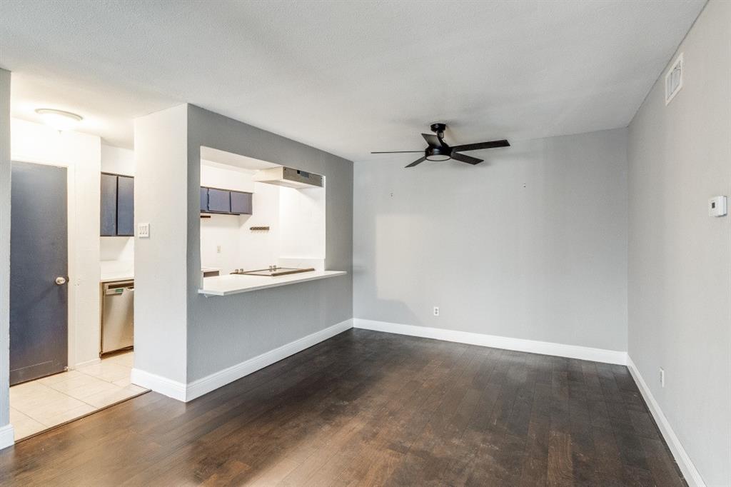 8110 Skillman Street, Unit 2019 Dallas, TX 75231 - Photo 6 of 13 a view of a kitchen with a sink and refrigerator