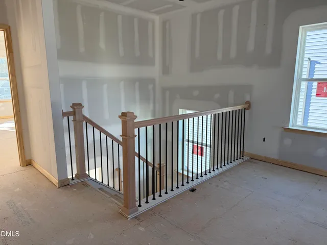 a view of an empty room with windows