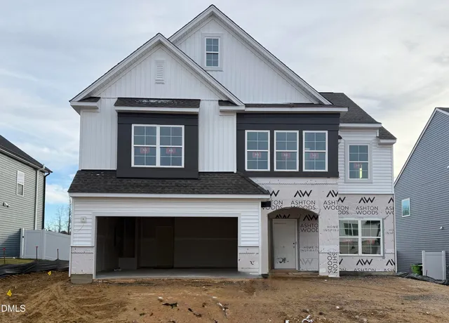 a kitchen that has a sink a stove and a refrigerator