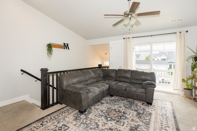 2452 West 500 South, Unit 2 Springville, UT 84663 - Photo 5 of 23 Carpeted loft area featuring a dark wood staircase railing, a ceiling fan with integrated lighting, and a sliding glass door providing outdoor access