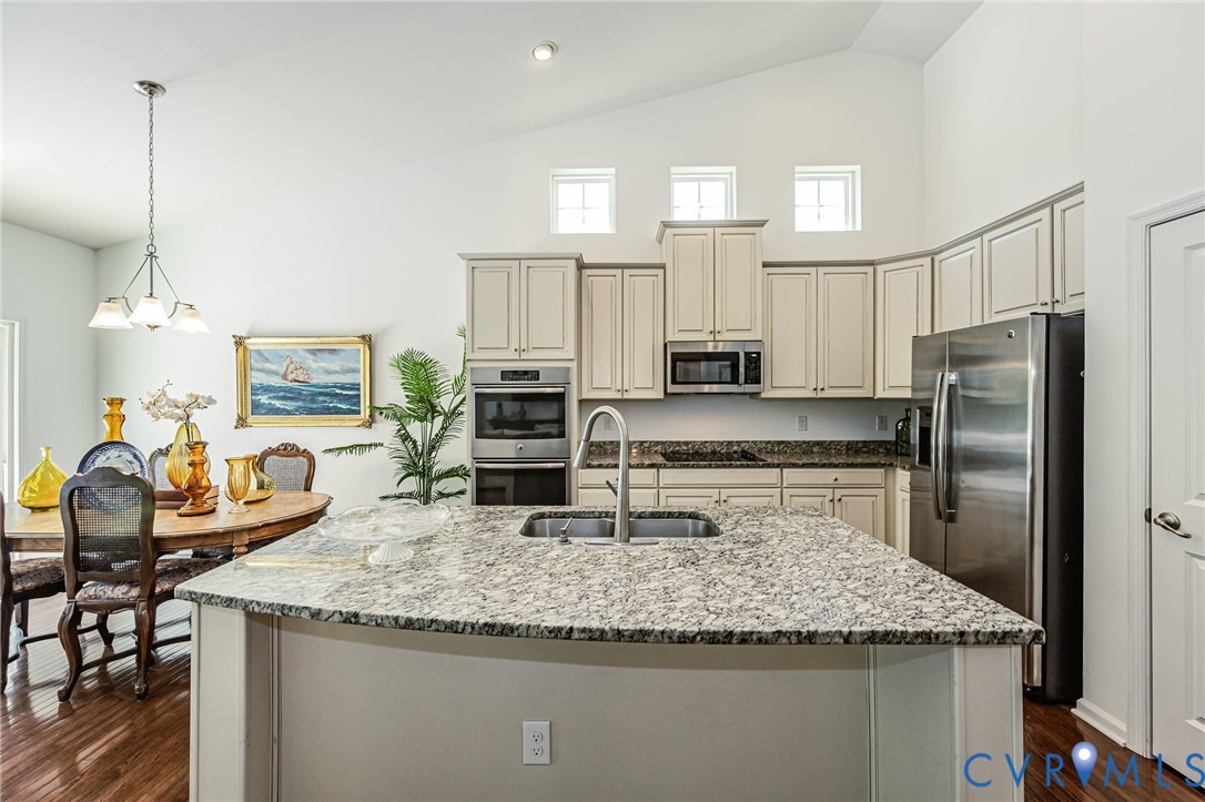 7435 Wicks Road Williamsburg, VA 23188 - Photo 29 of 82 Kitchen featuring a central island with granite co