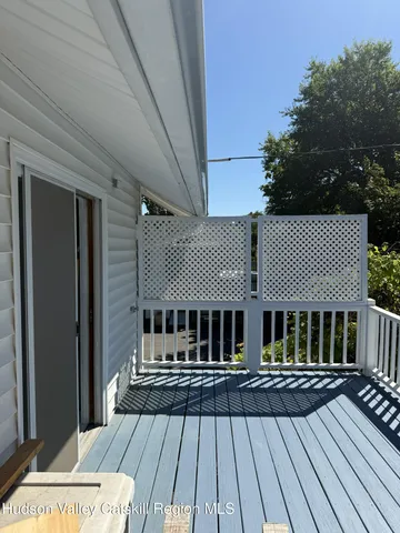 a view of house with deck outdoor seating