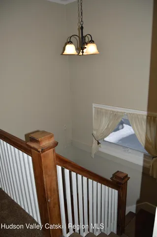 a view of a hallway with a chandelier