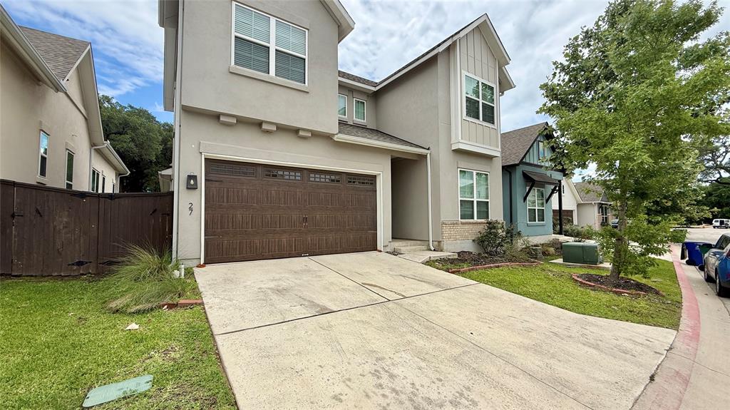 601 C-Bar Ranch Trail, Unit 27 Cedar Park, TX 78613 - Photo 2 of 29 Contemporary two-story residence with a stucco exterior and a prominent wood-finish garage door