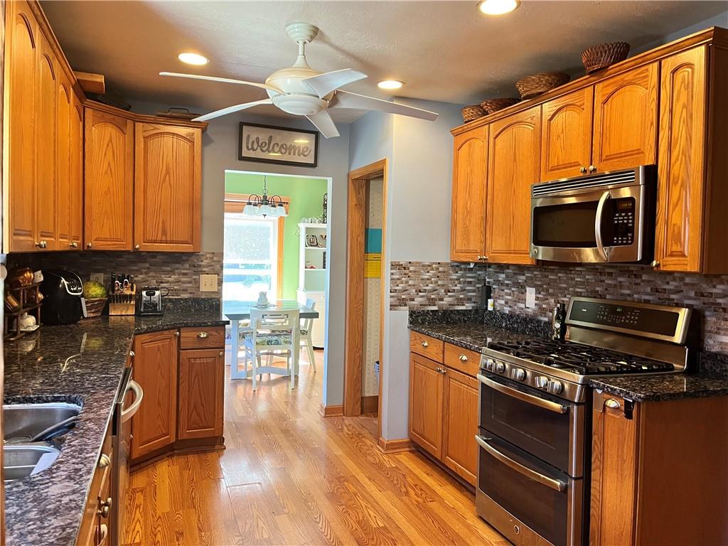 161 Freeport Road Butler, PA 16002 - Photo 2 of 24 a kitchen with stainless steel appliances granite countertop a stove and a microwave