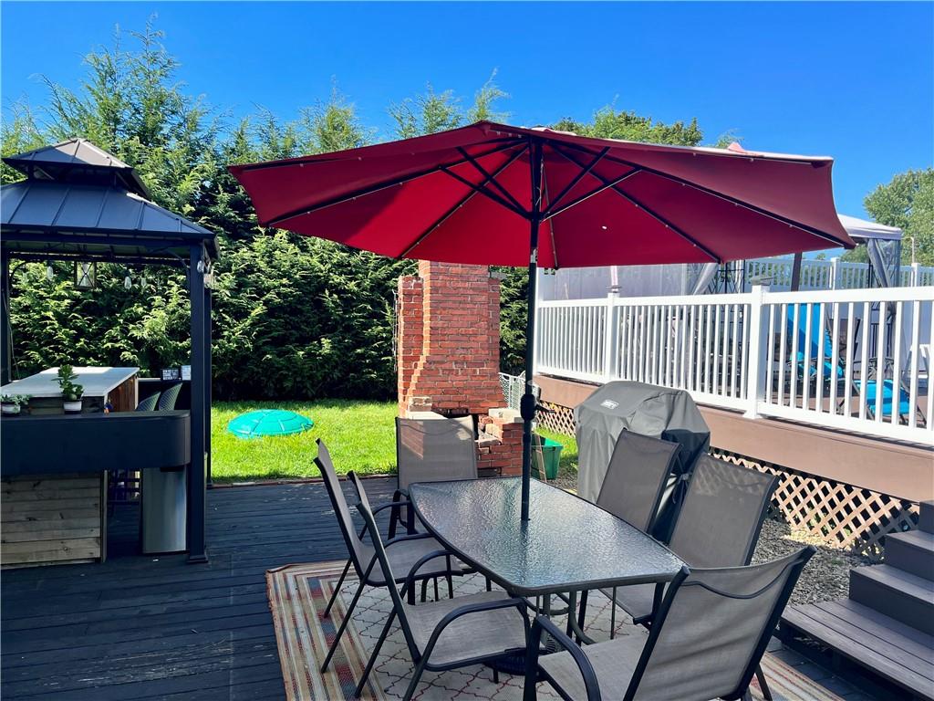 161 Freeport Road Butler, PA 16002 - Photo 5 of 24 a view of a patio with table and chairs under an umbrella