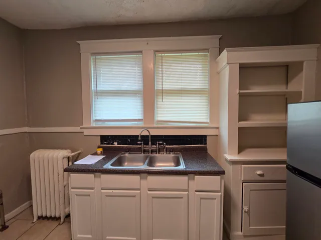 a kitchen that has a sink and a window