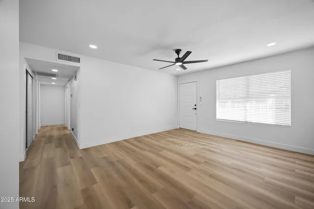 a view of an empty room with a window