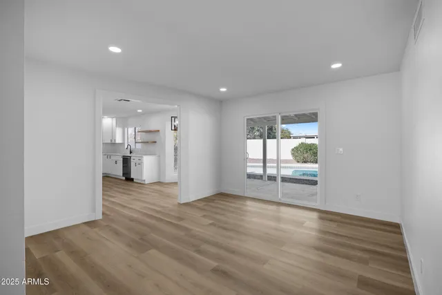 a view of a kitchen with a sink and a window