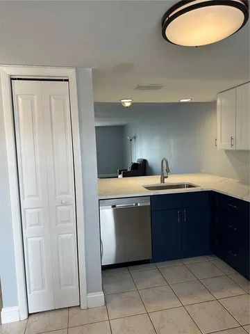 a kitchen with a sink and cabinets