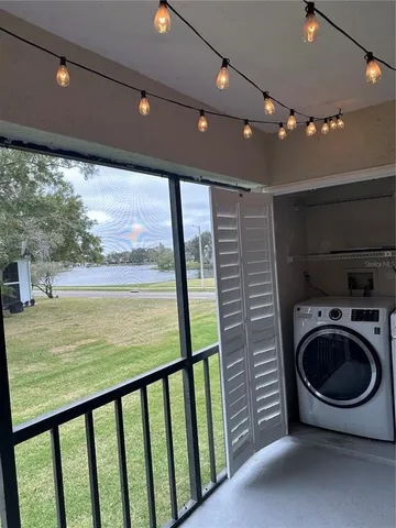 a view of a hallway with washer and dryer