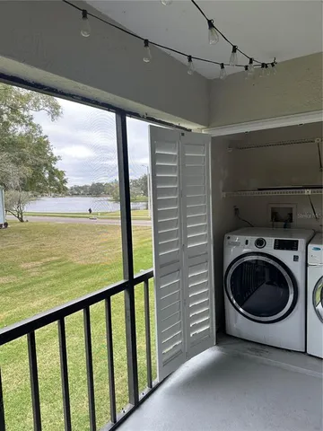 a view of a hallway with washer and dryer