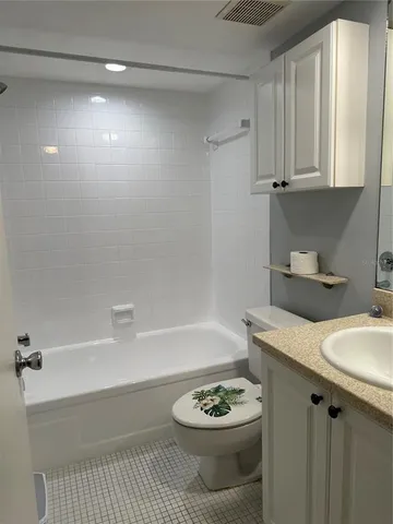 a bathroom with a sink a bathtub and a toilet