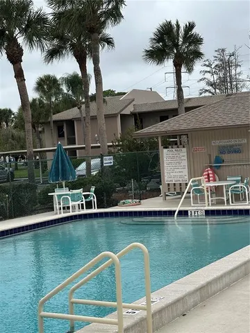 a front view of a house with a lake view