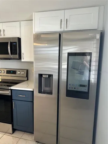 a kitchen with cabinets and a stove